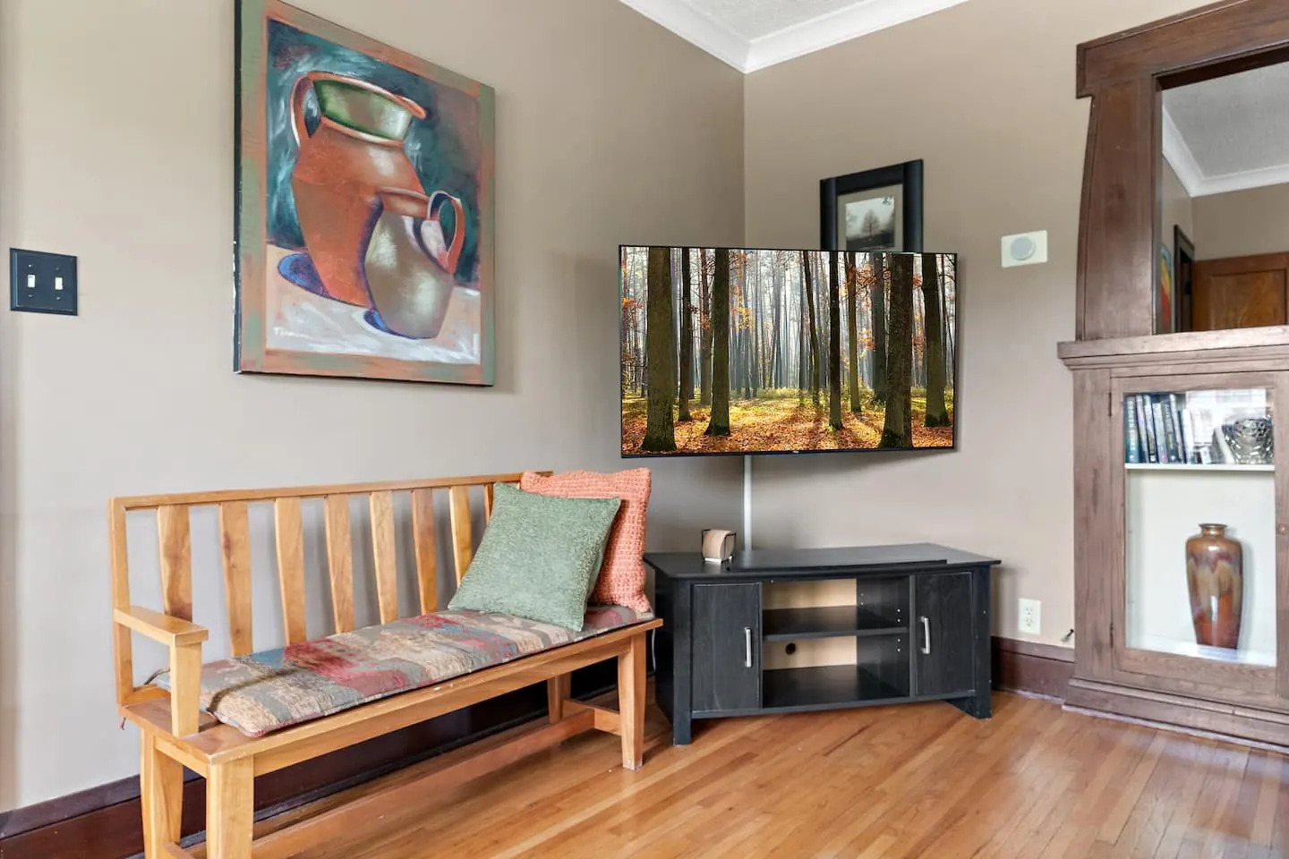 Entry bench under a painting