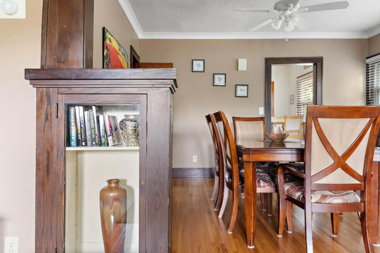 Original built-in cabinetry between dining and living rooms